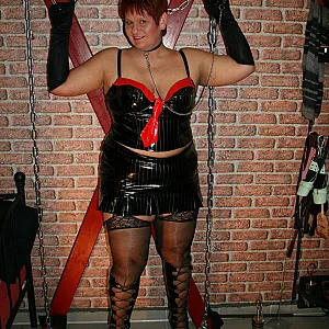 In latex paint outfit on the cross gallery image