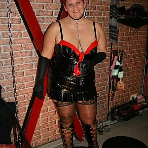 In latex paint outfit on the cross gallery image