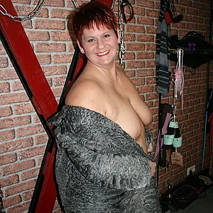 Posing in a gray fur coat gallery image