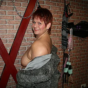 Posing in a gray fur coat gallery image