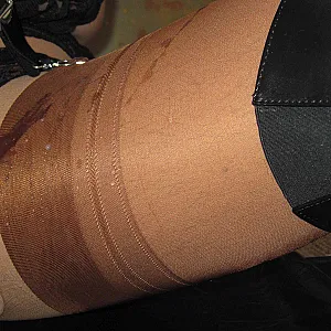 Crossdresser in Thigh-high Boots teases and cums on Nylons gallery image