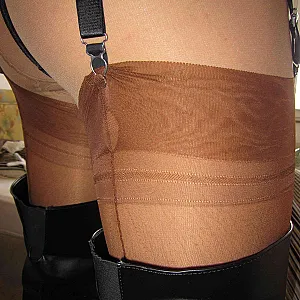 Crossdresser in Thigh-high Boots teases and cums on Nylons gallery image