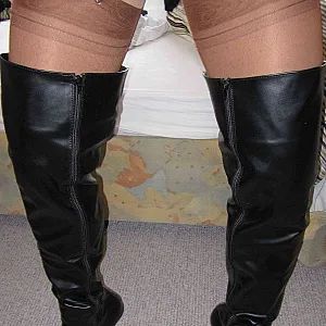 Crossdresser in Thigh-high Boots teases and cums on Nylons gallery image