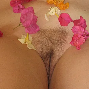 laying down on a bed of flowers gallery image