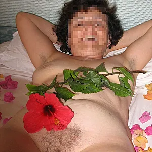 laying down on a bed of flowers gallery image
