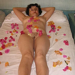 laying down on a bed of flowers gallery image