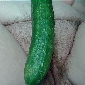 playing with  a cucumber gallery image