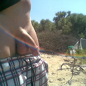 Naked and hard at the beach gallery image