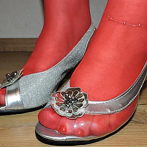 red straps and leather corsage gallery image