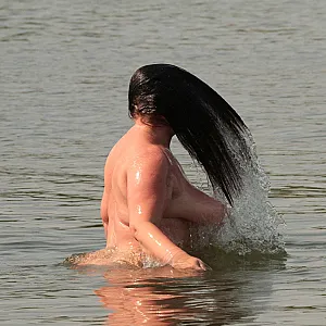 Water games at the nudist lake 1 gallery image