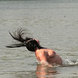 Water games at the nudist lake 1 gallery image