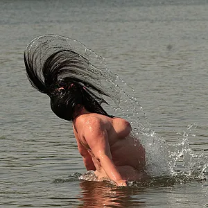 Water games at the nudist lake 1 gallery image