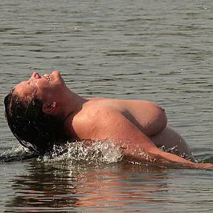 Water games at the nudist lake 1 gallery image