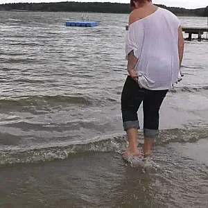 With RIPPED JEANS into the lake gallery image