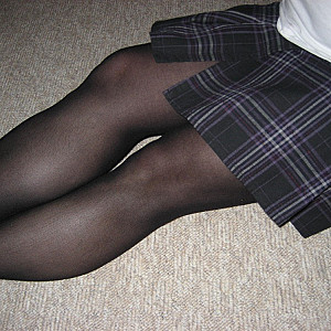 in a skirt and pantyhose gallery image