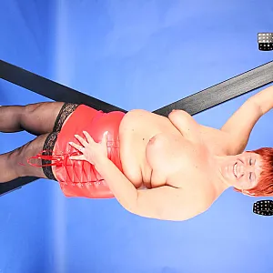 In red fetish outfit gallery image