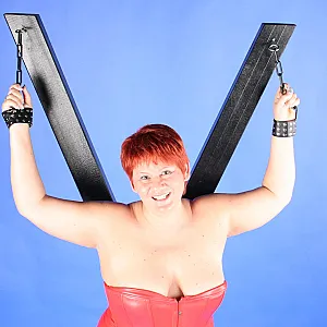 In red fetish outfit gallery image