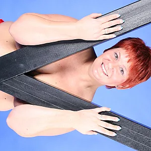 In red fetish outfit gallery image