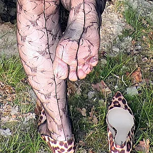 near the tree in a lacquedress gallery image
