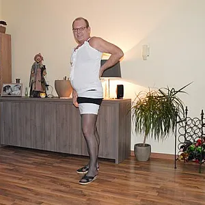 in female lingerie at home gallery image