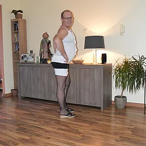 in female lingerie at home gallery image