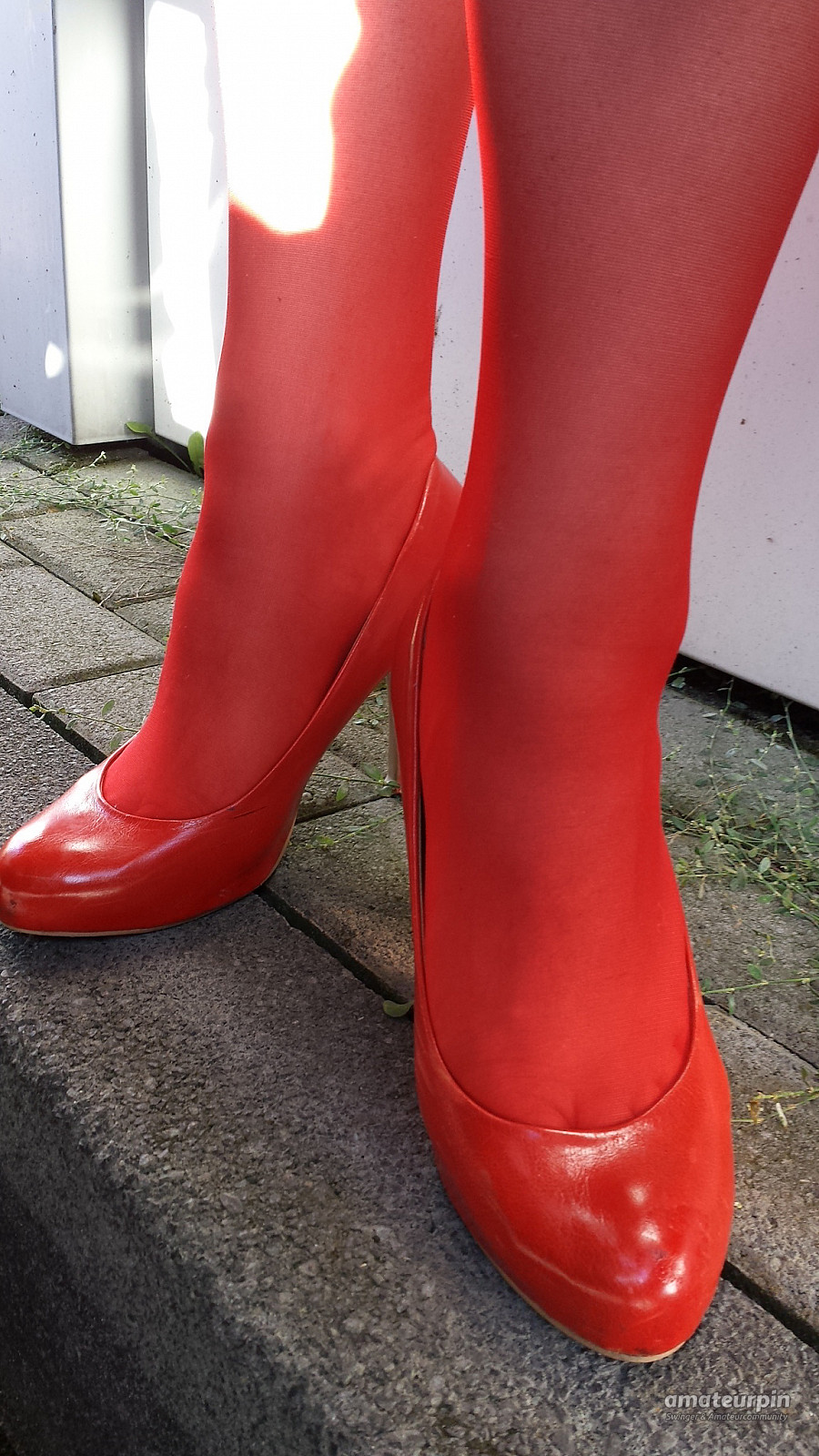 On tour with red nylons and heels gallery image