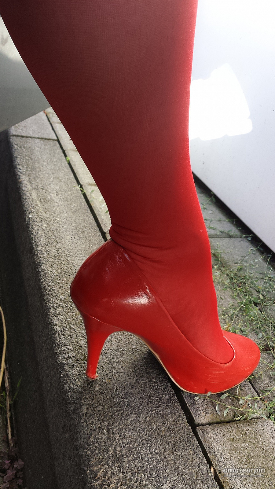 On tour with red nylons and heels gallery image