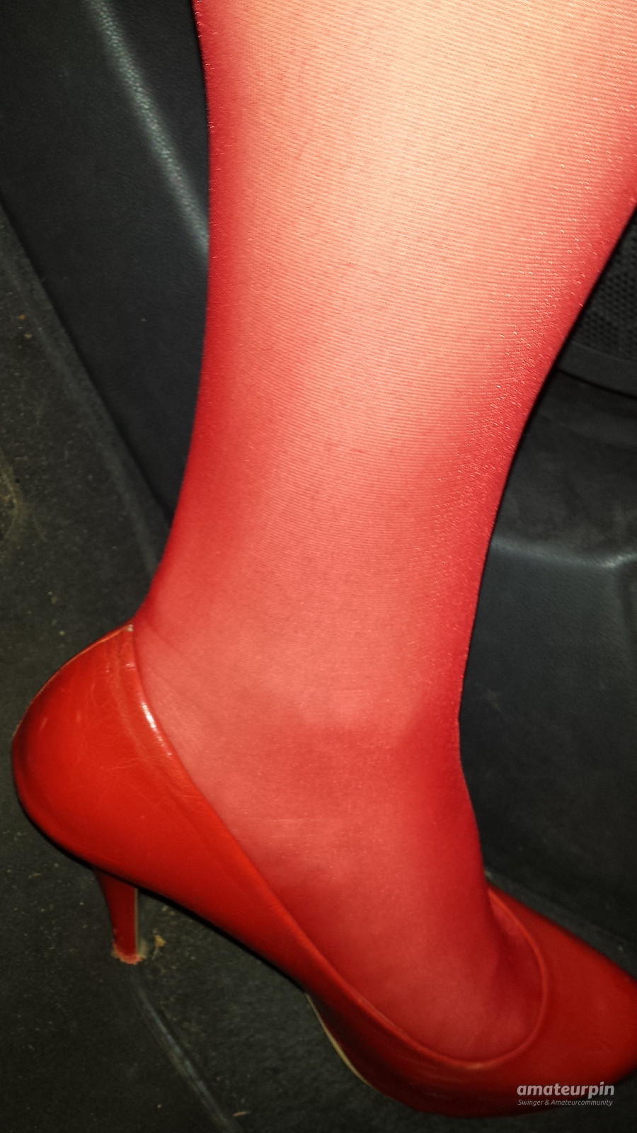 On tour with red nylons and heels gallery image