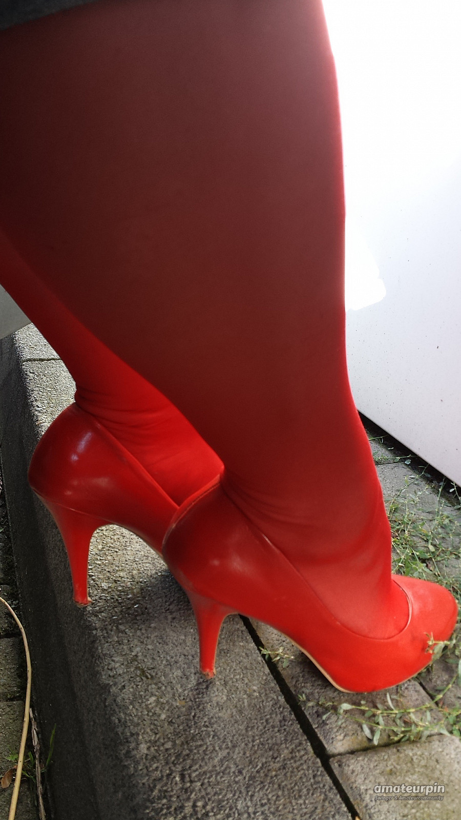 On tour with red nylons and heels gallery image