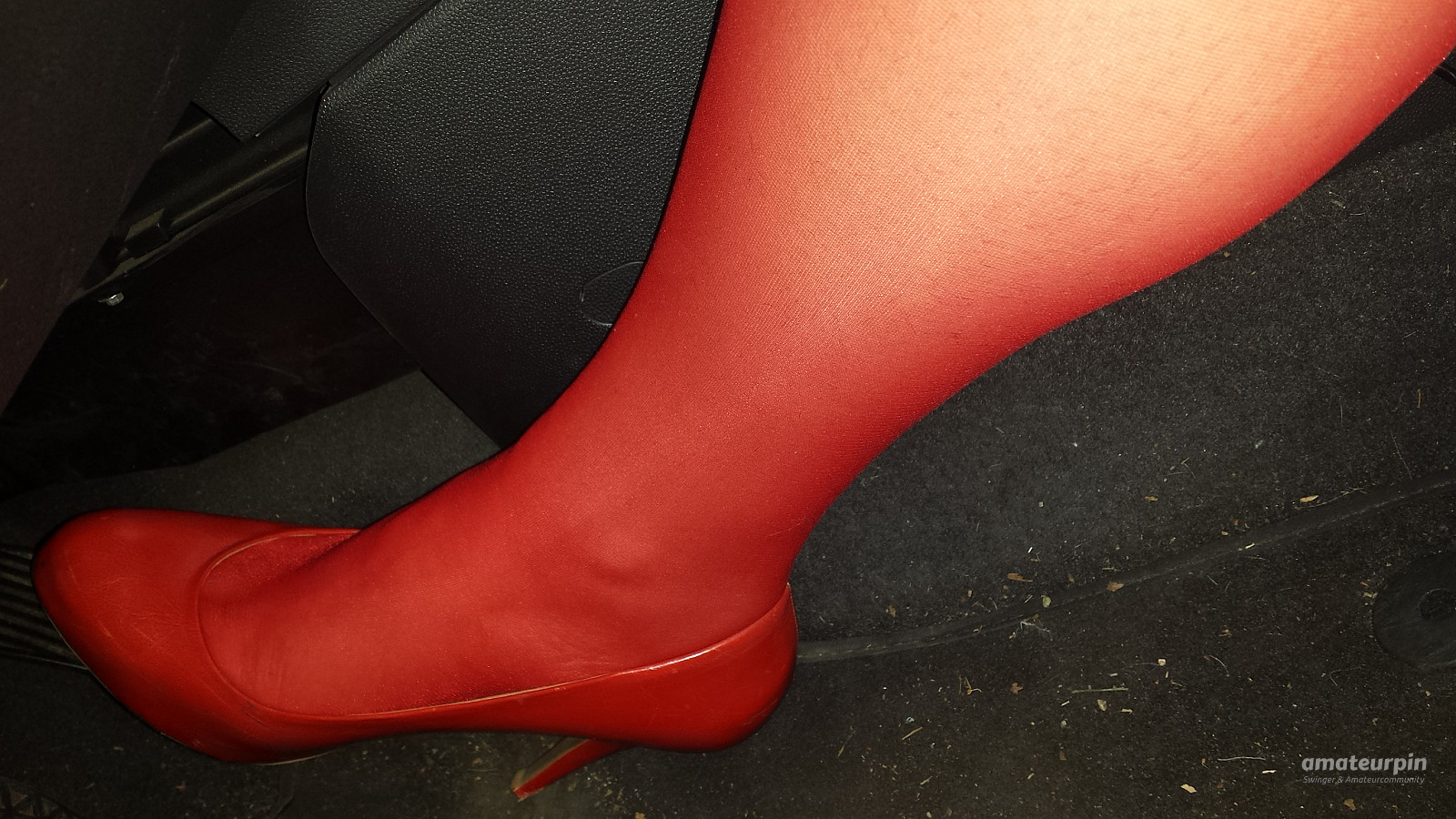 On tour with red nylons and heels gallery image