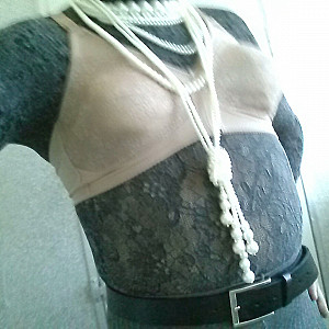 At work in ribbed pantyhose (ssh), bra and lace turtleneck sweater. Galeriebild