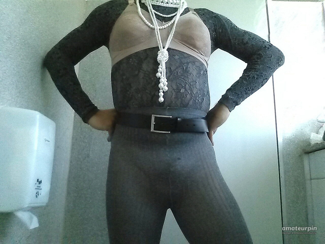 At work in ribbed pantyhose (ssh), bra and lace turtleneck sweater. gallery image