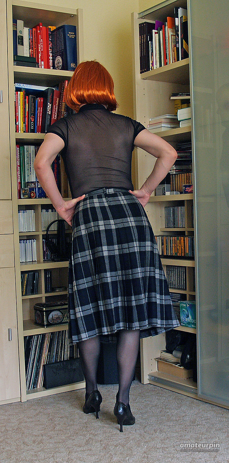 in a checkered skirt gallery image