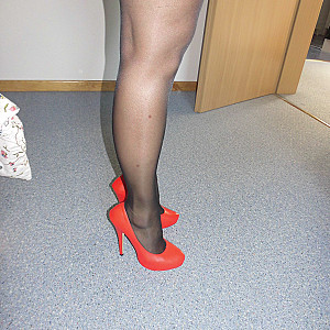 P.girl in nylons and sexy red heels gallery image