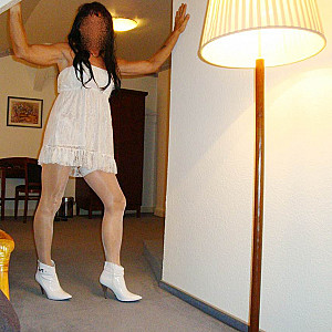 horny in a white minidress gallery image