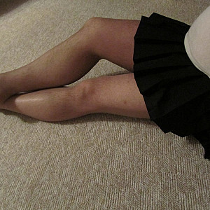 in a skirt and pantyhose gallery image