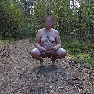 Slave naked on a forest path gallery image