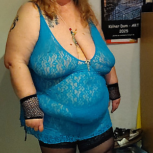 Plump woman in blue lingerie gallery image