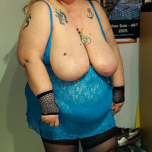 Plump woman in blue lingerie gallery image