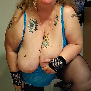 Plump woman in blue lingerie gallery image