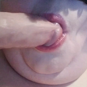 Sucking on the dildo 2 gallery image
