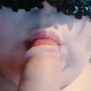 Sucking on a dildo gallery image