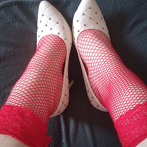 White high heels and red fishnet stockings gallery image