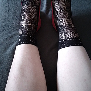 Pink heels and black ankle socks gallery image